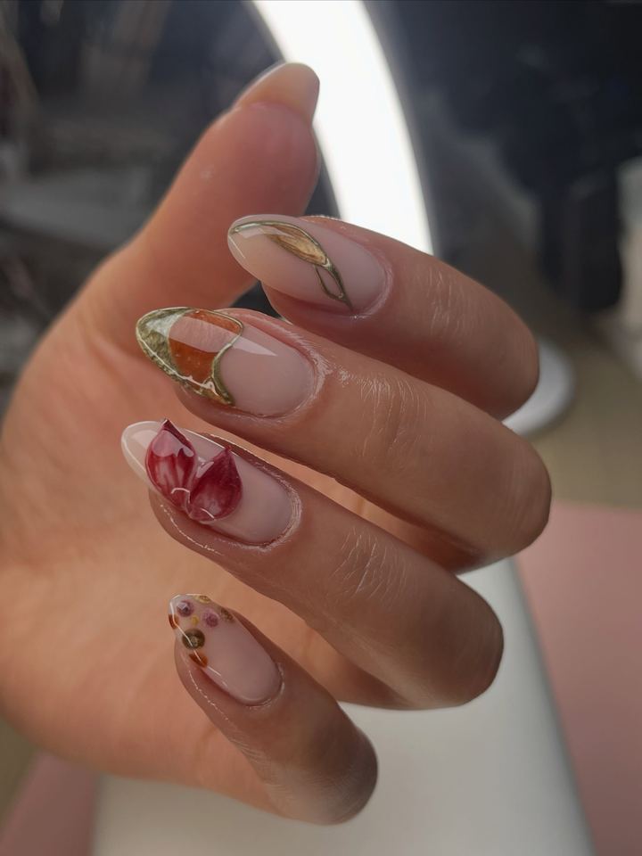 Nude nails with hand painted red flowers and gold foil accents